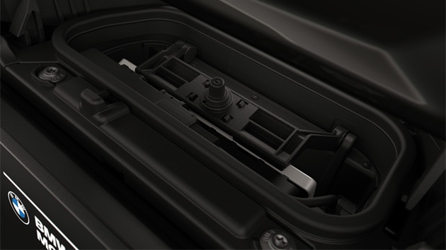 Integrated charging compartment with mobile phone.